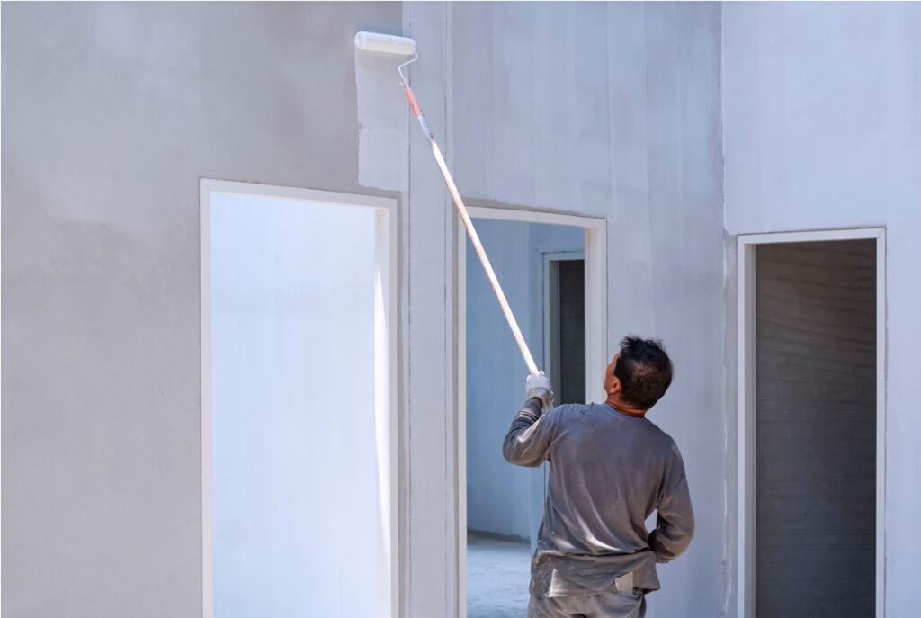 asian construction worker painting white primer co 2022 11 05 00 02 16 utc