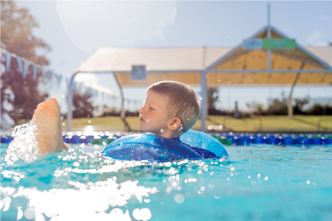 child in tube in swimming pool 2021 08 28 23 40 48 utc