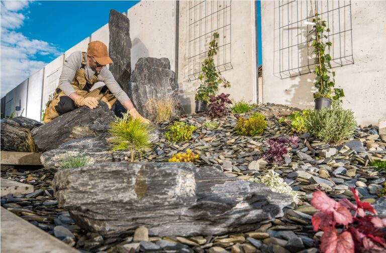 professional gardener finishing beautiful rockery garden