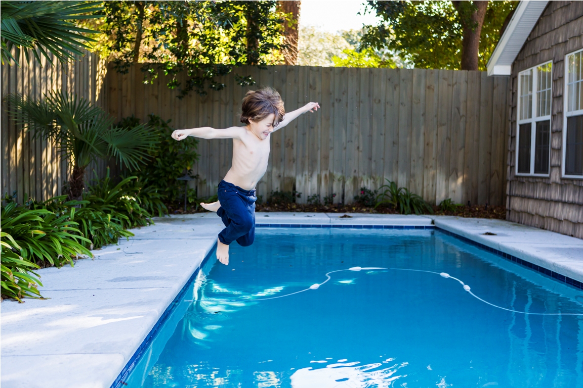 a six year old boy leaping into a swimming pool 2022 03 04 02 10 24 utc