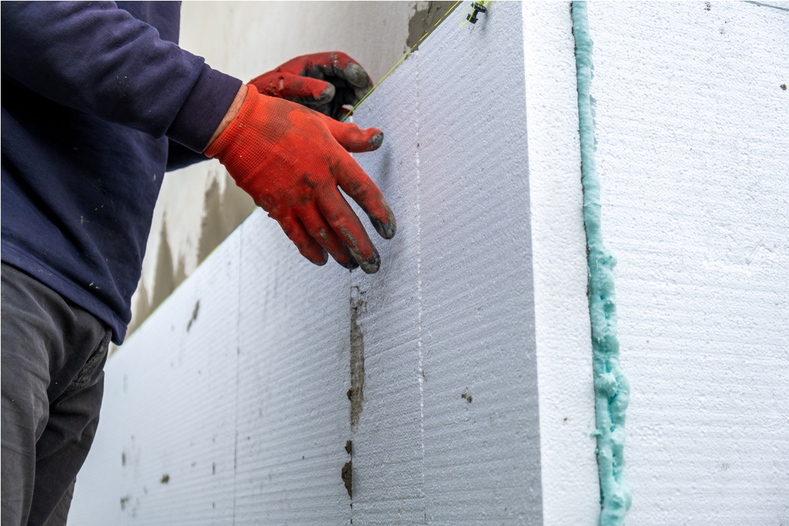 construction worker installing styrofoam insulatio 2022 11 15 01 39 37 utc