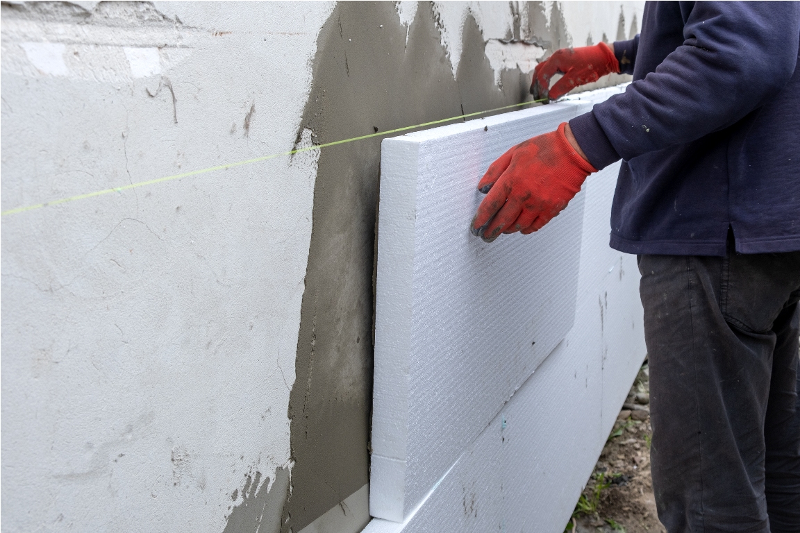 construction worker installing styrofoam insulatio 2023 07 17 20 53 59 utc
