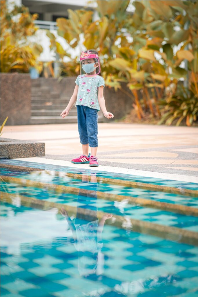little girl walking near the swimming pool with re 2022 11 14 12 30 13 utc