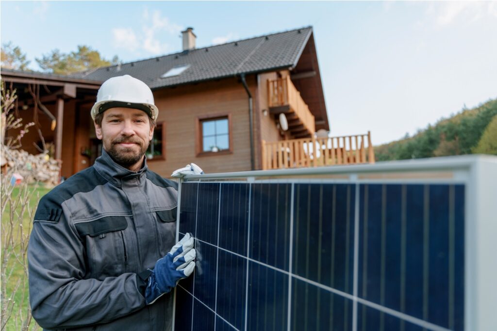 smiling handyman solar installer carrying solar mo 2022 11 12 14 54 35 utc