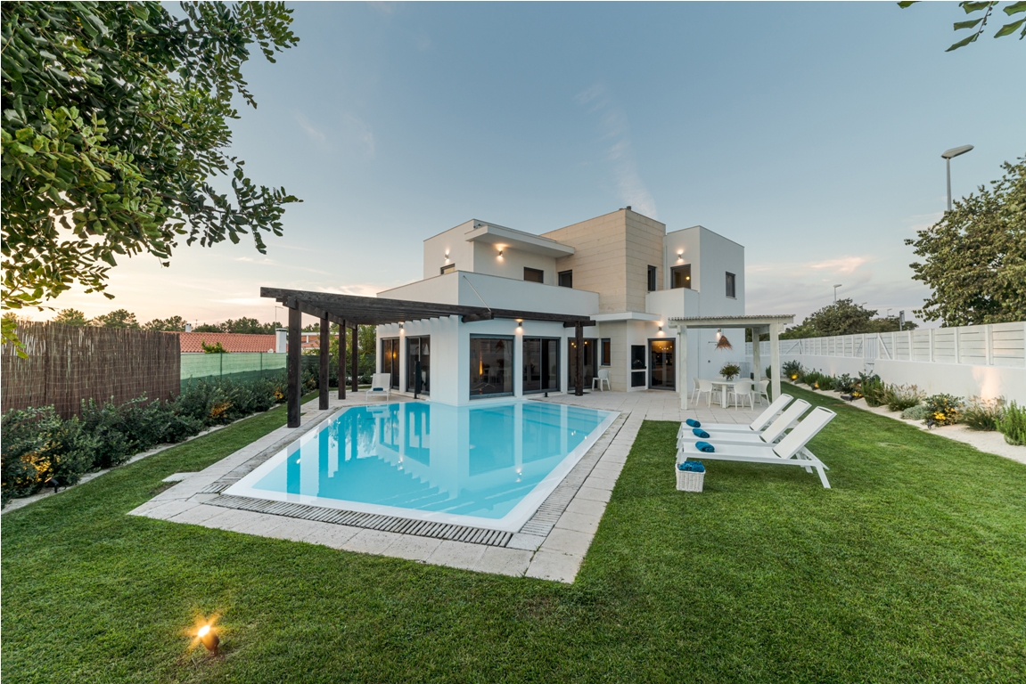 modern house with garden swimming pool and wooden pergula