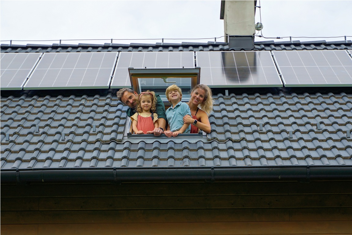 happy family leaning out from skylight window in t 2022 11 11 00 59 45 utc