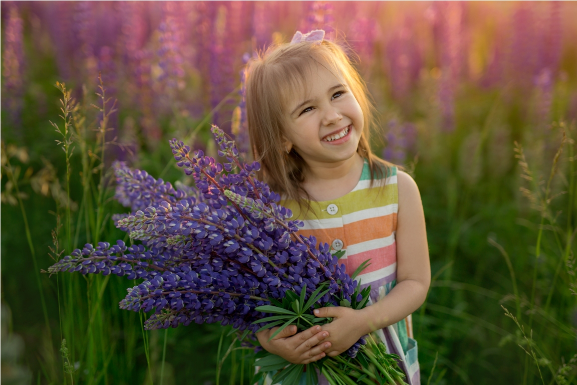 girl with a bouquet of lupines in a field of purpl 2023 11 27 05 01 28 utc