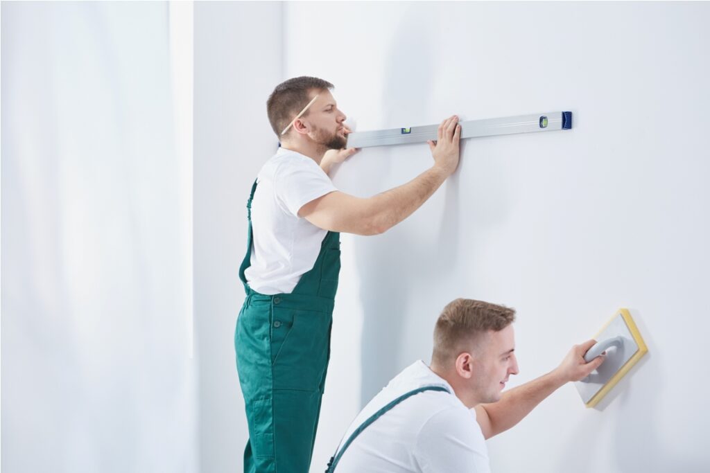 two professional men working together at home renovation